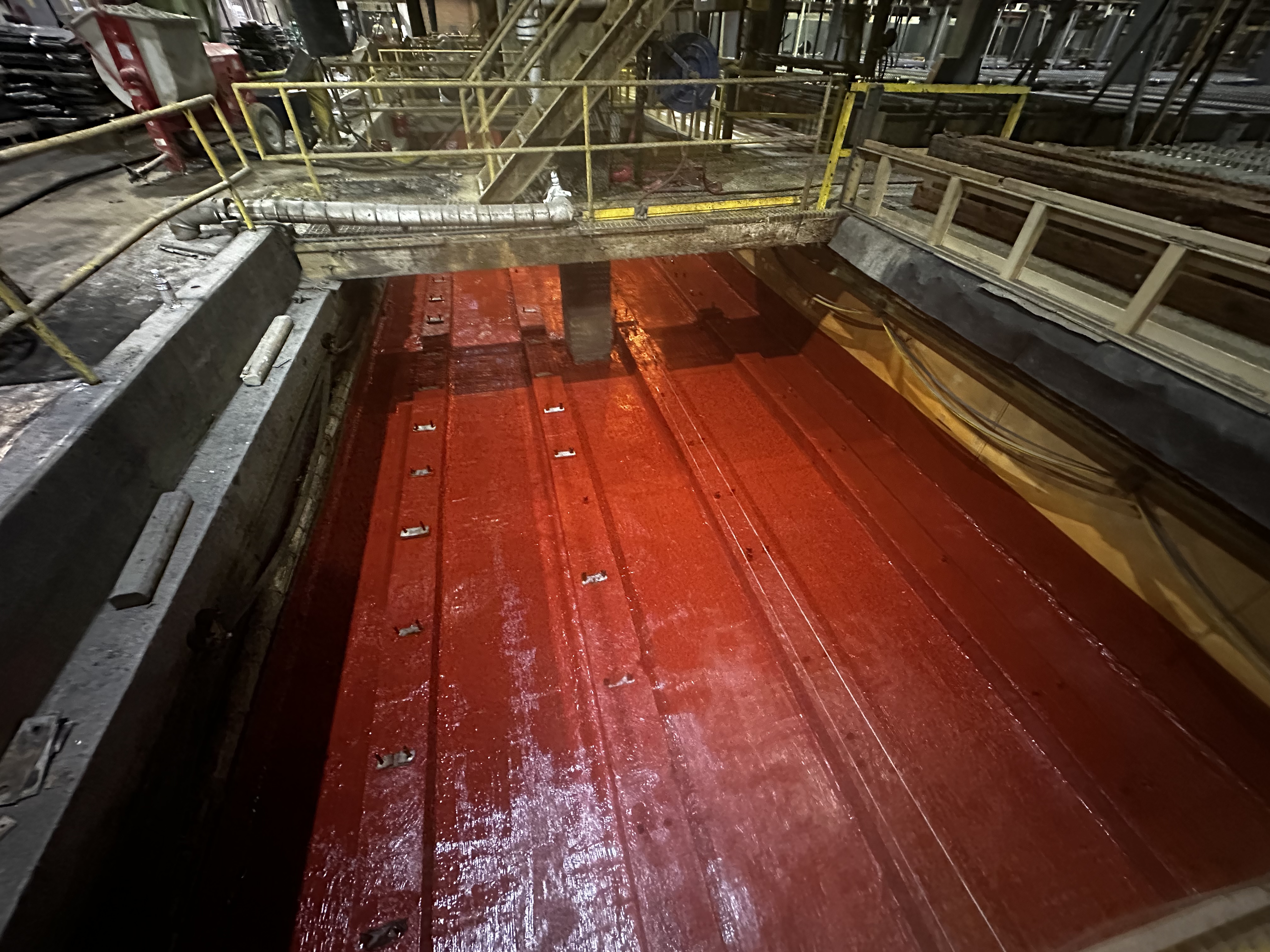 Carboline Plasite 4500S immersion-grade epoxy coating applied to car well